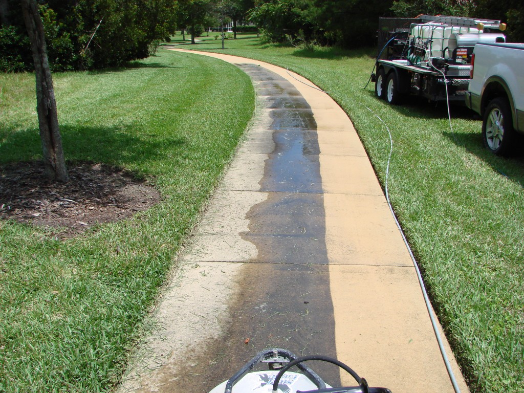 Pressure washing sidewalks using a surface cleaning.